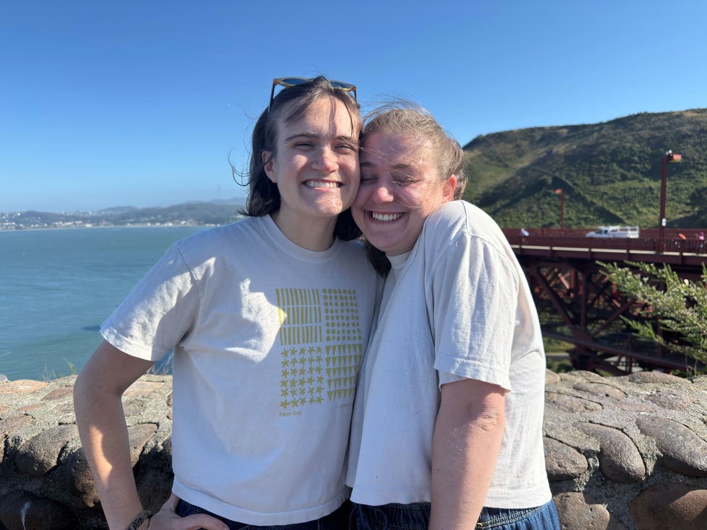 The two of us cheek to cheek on the coast near the Golden Gate Bridge